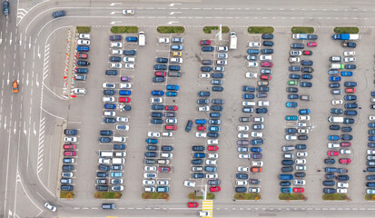 Aerial view of a parking lot with many cars