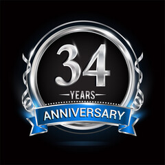 Logo celebrating 34th years anniversary with silver ring and blue ribbon.