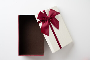 Open Gift box mockup on the white table. Merry christmas and happy new years background.