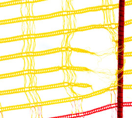Torn yellow mesh isolated on white background.