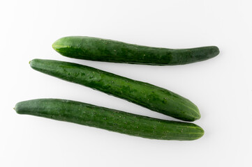 Pile Cucumber put on white table isolated background. Healthy vegetables and food.