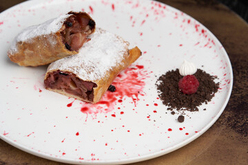 Strawberry biscuit roll with  berry syrup and fromage frais