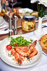 Fried shrimps in a plate on a table.