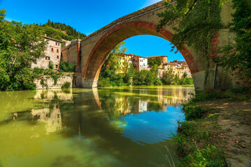 Fototapeta na wymiar Ponte della Concordia, Roman bridge and river Metauro. Fossombrone, Marche, Italy.