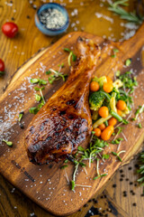 Roasted turkey drumstick served with baby carrot