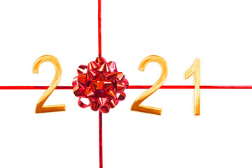 2021 golden numbers, red gift bow and ribbon isolated on white, new year and christmas card