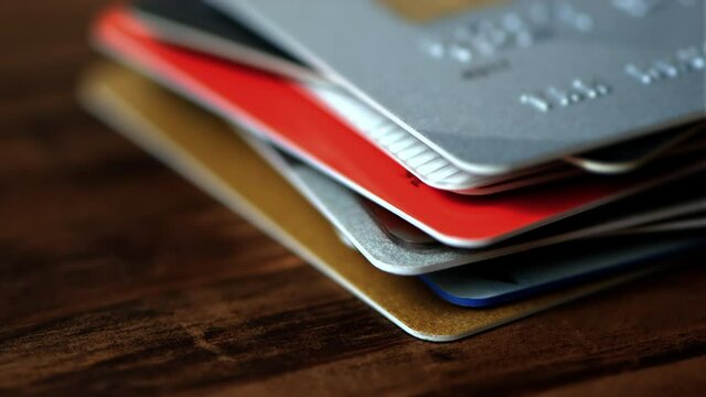 Time lapse of stack of credit cards close up.