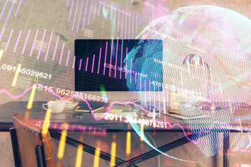 Double exposure of forex graph and work space with computer. Concept of international online trading.