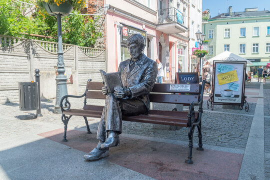 Tczew, Poland - June 26, 2020: Roman Landowski on bench sculpture.