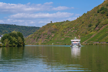 View to an excursion boat on the Moselle near Beilstein / Germany on a sunny day