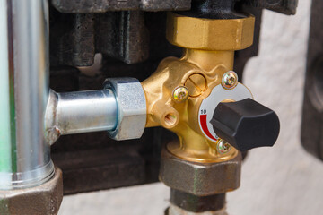 Manual three way ball valve on pipe of industrial boiler heating system