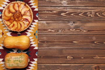 Top view of a thanksgiving pie on brown wooden table