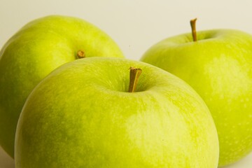 green apples on a white background