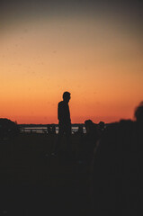Fototapeta na wymiar silhouette of a person on the beach
