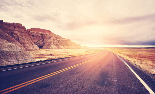 Scenic desert road at sunset, color toning applied, travel concept, USA.