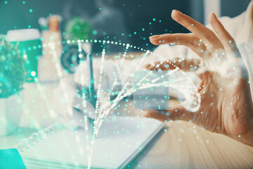 DNA theme hologram over woman's hands writing background. Concept of education. Double exposure