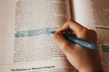 Student doing homework. underline. words. write. student doing his doctoral thesis. graduate....