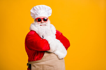 Turned photo of white bearded santa claus in culinary chef headwear cap cross hands cook x-mas...
