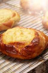 Fresh bun cake with pudding on a tray