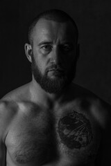 Low-key male portrait in studio 