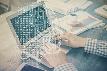 Man typing on keyboard background with brain hologram. Concept of big Data.