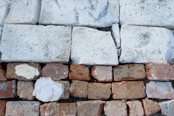 Background of red, orange, white old bricks 