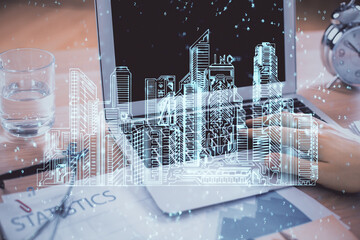 High tech city drawing with businessman working on computer on background. Smartcity concept. Double exposure.