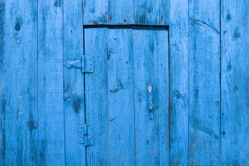 closed old blue wooden gate isolated
