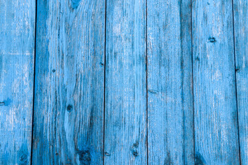 structure of vertical wooden boards with a blue background
