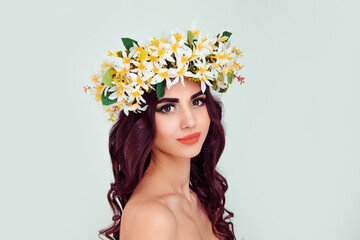 woman wearing floral headband tiara crown isolated light green background
