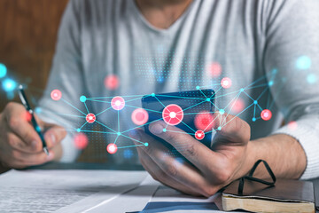 Double exposure of man signing contract with phone and abstract technology network icon hologram....