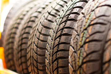 A stack of winter tires. All-season tires. Car tires in store