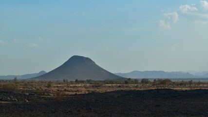 Fototapeta na wymiar Volcano in desert, on the way between Jeddah and Medina, Saudi Arabia, KSA