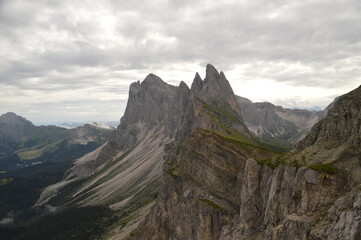 Hiking on the dramatic mountain ridge of Seceda in South Tyrol's Dolomites, Northern Italy