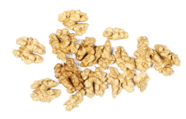 Unshelled walnuts pile isolated on white background, top view