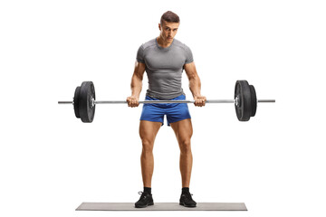 Fototapeta premium Full length portrait of a bodybuilder weight lifting and looking at camera