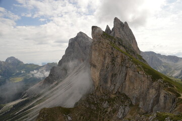 Hiking on the dramatic mountain ridge of Seceda in South Tyrol's Dolomites, Northern Italy