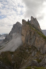 Hiking on the dramatic mountain ridge of Seceda in South Tyrol's Dolomites, Northern Italy