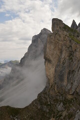 Hiking on the dramatic mountain ridge of Seceda in South Tyrol's Dolomites, Northern Italy