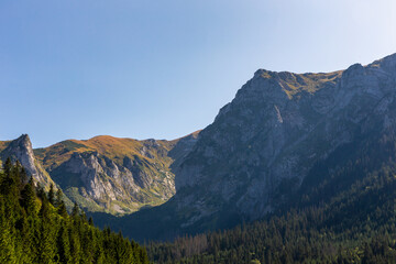 Tatra Mountains landscape with Giewont, Siodlowa Turnia, Mnichowe Turnie and Wielka Turnia peaks, seen from Wielka Polana Malolacka Glade in autumn, Poland © Cleop6atra