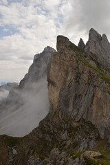 Hiking on the dramatic mountain ridge of Seceda in South Tyrol's Dolomites, Northern Italy