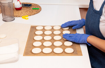 Obraz na płótnie Canvas The process of making dessert-macarons.