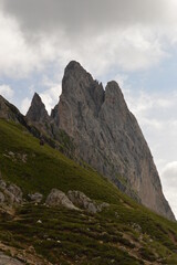 Hiking on the dramatic mountain ridge of Seceda in South Tyrol's Dolomites, Northern Italy