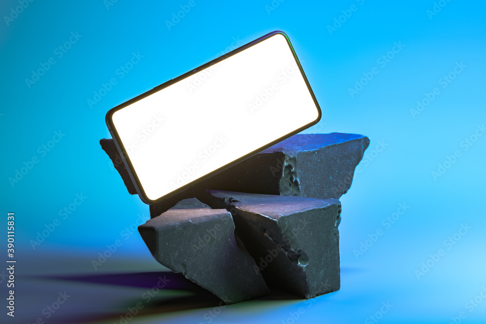 Poster modern mobile phone with blank screen on concrete broken forms or stone at blue background.3d render