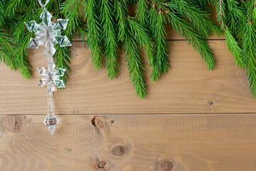 Christmas background with decorations on wooden board.