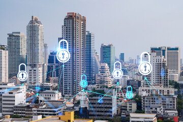 Obraz premium Padlock icon hologram over panorama city view of Bangkok to protect business in Asia. The concept of information security shields. Double exposure.