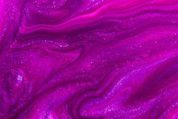 Abstract sparkling purple background. Close up of nail polish texture. Soft focus.