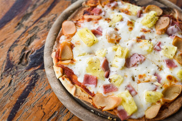 Homemade pizza italian is cooked traditional food Pizza cheese slice on wooden tray and served on a wooden table