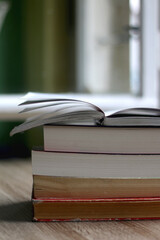 Stack of books on the table. Selective focus.