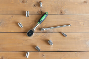 A multipurpose precision tool kit set box showing wrenches with different interchangeable bit head sizes arranged